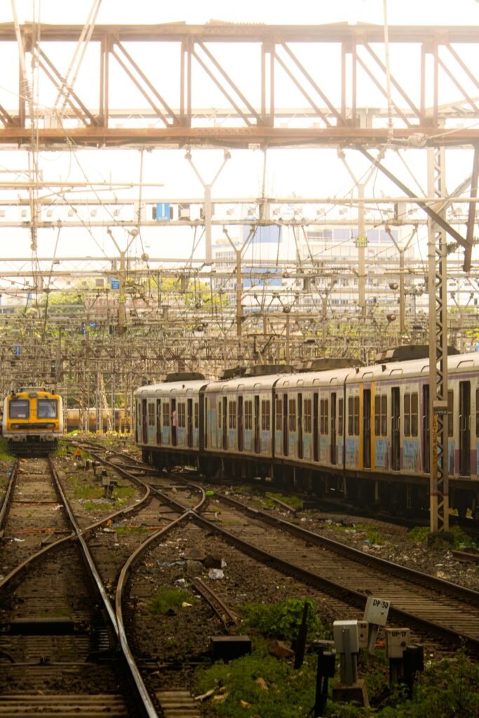 A Mumbai local suburban train navigating the bustling railway tracks that carry 8 million passengers daily