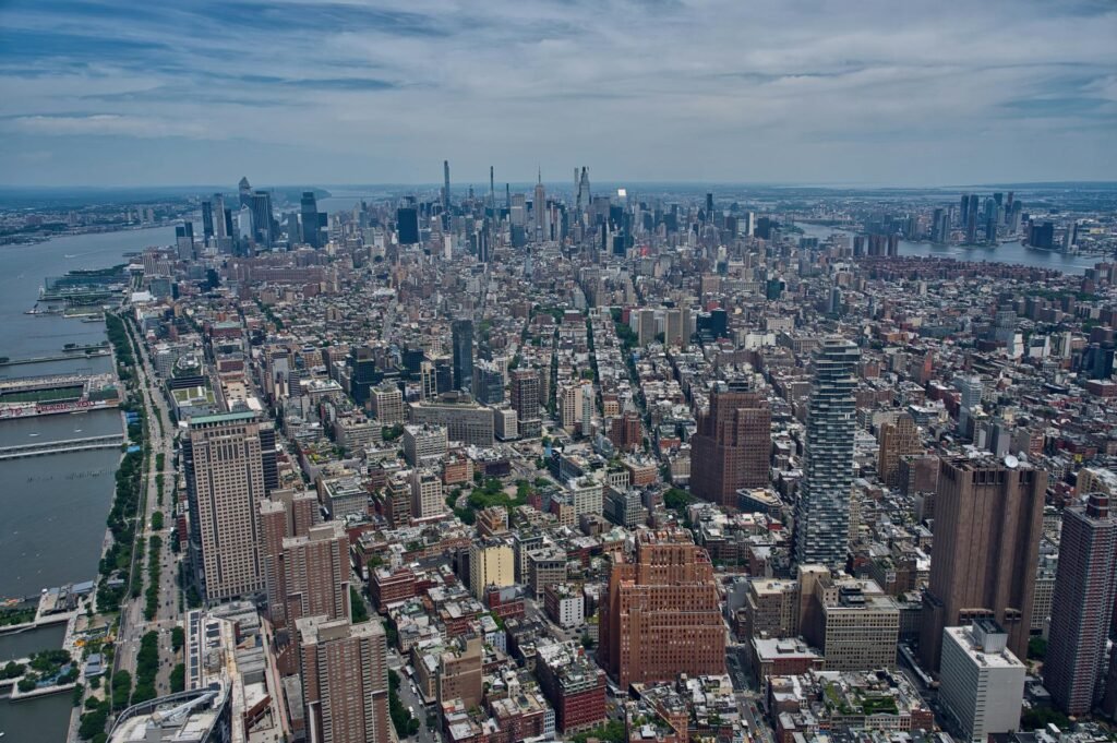 Aerial view of Manhattan and the Hudson River showing NYC's dense architectural landscape and grid plan