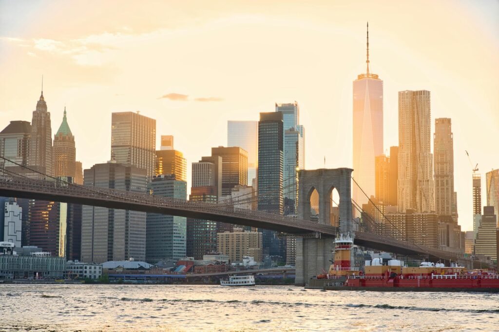 Stunning view of the Brooklyn Bridge and New York City skyline at sunset spanning the East River