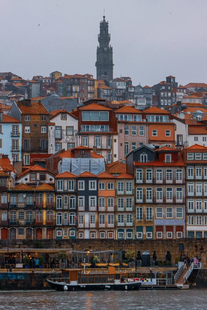 The UNESCO-listed Ribeira District in Porto — the colorful historic Baroque townhouses cascading down to the Douro River waterfront, the city's defining medieval-and-Baroque heritage core