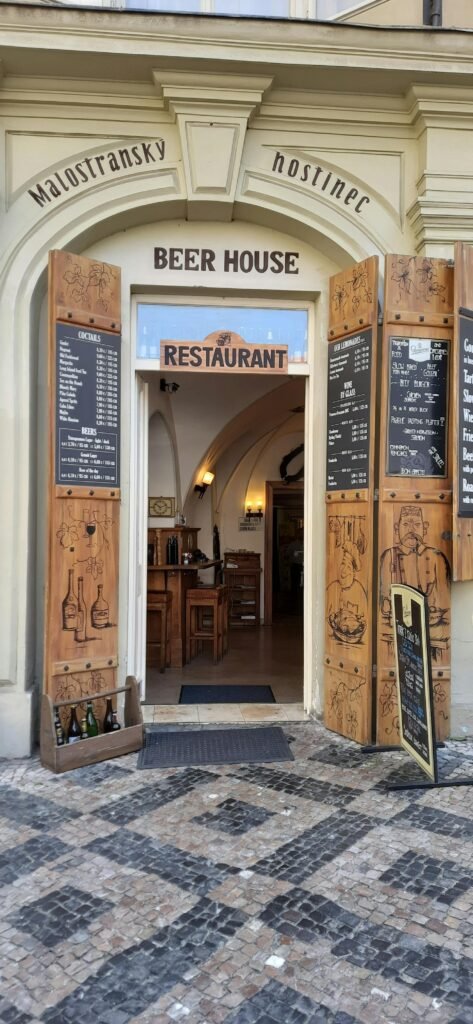 Inviting entrance to a traditional Czech beer house restaurant in Prague