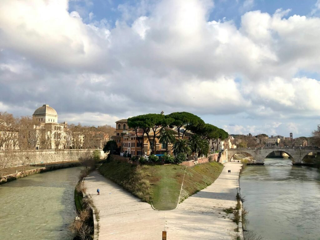 Aerial view of Tiber Island and the Tiber River winding through historic Rome, Italy