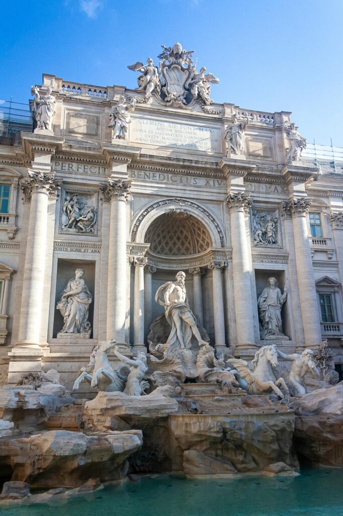 The Trevi Fountain in Rome, a 1762 Baroque masterpiece showcasing intricate sculptures and turquoise water