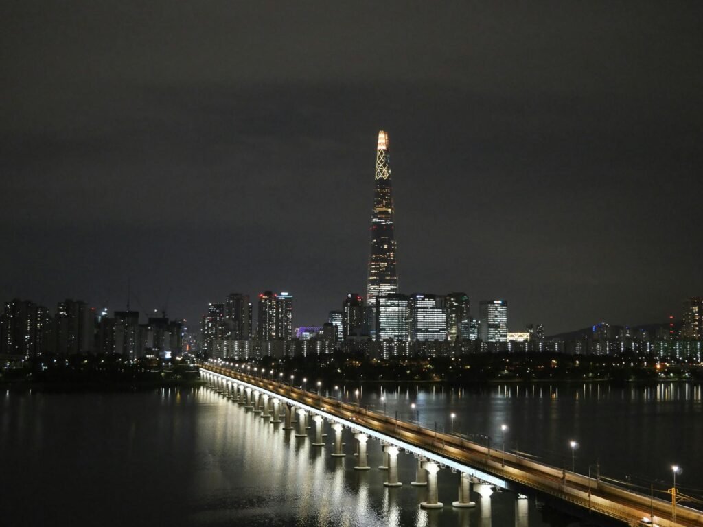 Seoul's night skyline featuring the iconic 555-meter Lotte World Tower and the Han River