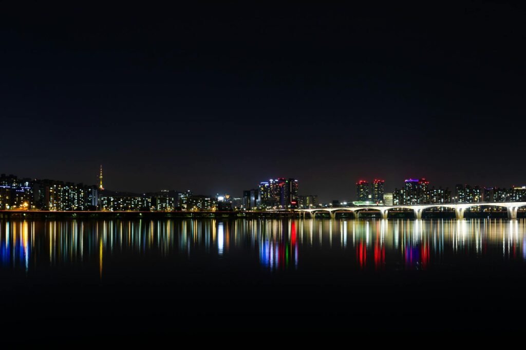 Night view of Seoul's illuminated skyline reflected over the Han River