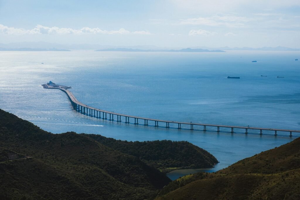 Aerial view of the Hong Kong-Zhuhai-Macau Bridge — the world's longest sea crossing — spanning the Pearl River Estuary in calm waters