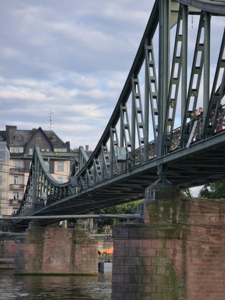 The Eiserner Steg, Frankfurt's 19th-century iron footbridge over the river Main, leading toward the Museumsufer