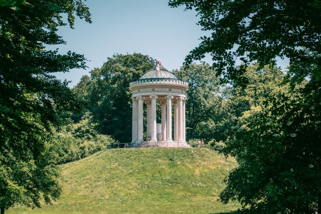 The Monopteros, a Greek-style temple on a grassy hill in Munich's English Garden, one of the world's largest urban parks