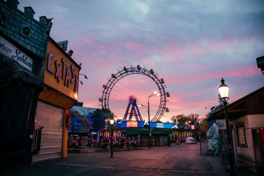 The illuminated Wiener Riesenrad giant Ferris wheel at the Prater in Vienna at dusk